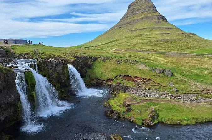 Kirkjufell mountain with green slopes in summer